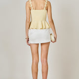 Bow Accent Peplum Sleeveless Top