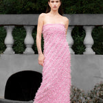 Lady wearing pink strapless ruffled maxi dress