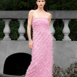 Lady wearing pink strapless ruffled maxi dress