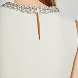 Jewel Trim Neck Peplum Knit Top