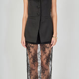 Close-up view of black tailored vest lace maxi dress featuring a V-neckline, button-front closure, and structured sleeveless bodice.
