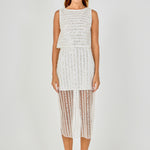Full-length front view of an off-white sleeveless sequin crop top featuring horizontal sequin stripes and a cropped hem, styled with a matching vertical sequin stripe sheer mesh midi skirt.