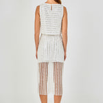 Back view of off-white sleeveless sequin crop top featuring a back keyhole button closure and horizontal sequin stripes, paired with a matching vertical sequin stripe skirt.