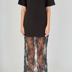Close-up view of black mix media maxi dress featuring a crewneck short-sleeve t-shirt bodice and sheer floral lace trim.