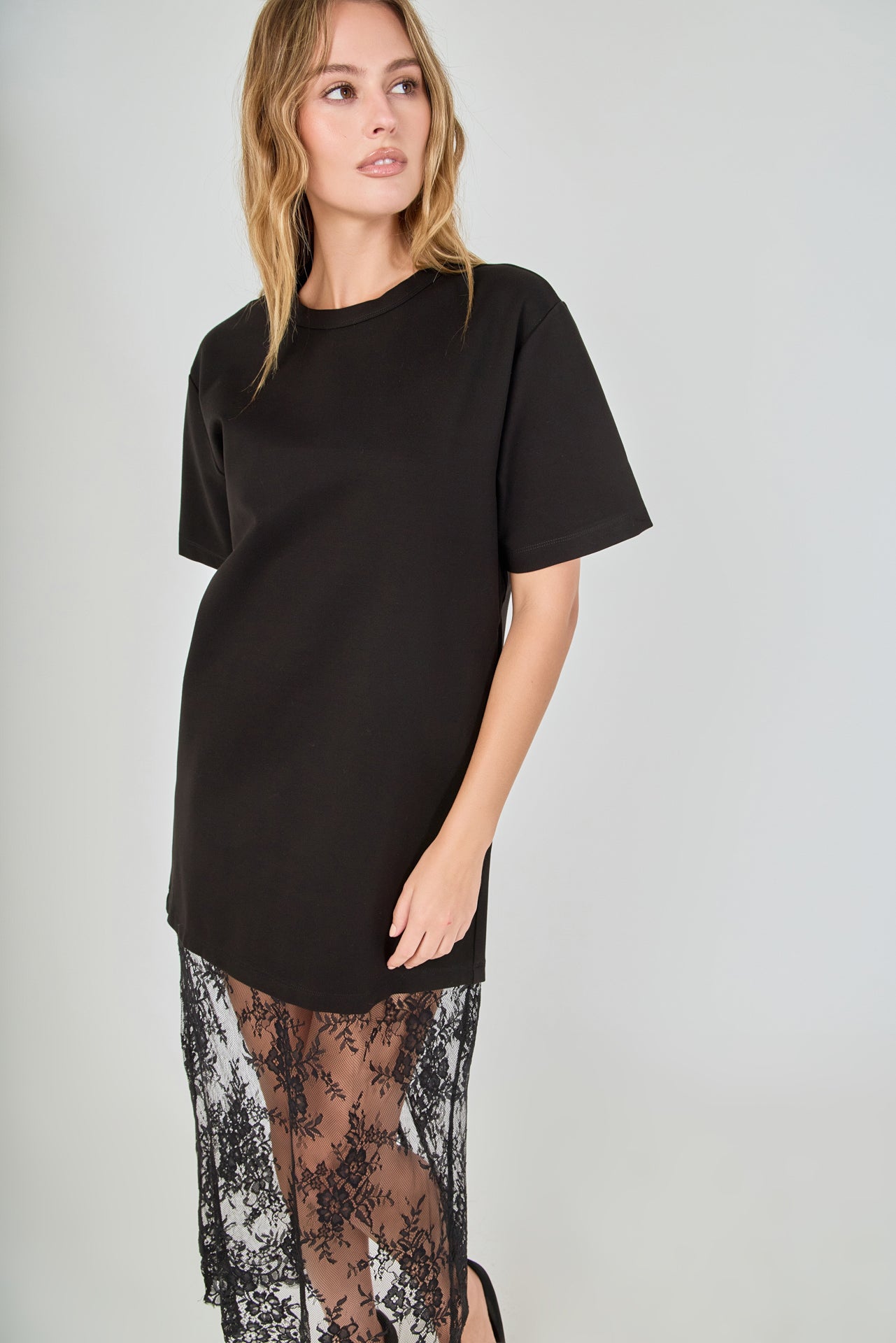 Black mix media maxi dress featuring a short-sleeve boxy t-shirt bodice and a sheer floral lace skirt.
