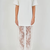 Close-up view of white mix media maxi dress featuring a crewneck short-sleeve t-shirt bodice and sheer floral lace trim.
