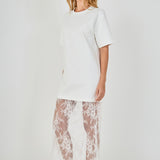 Side view of white mix media maxi dress featuring a short-sleeve boxy t-shirt top and a sheer floral lace skirt.