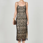 Black beaded lace midi dress featuring thin spaghetti straps, a scoop neckline, nude inner lining, and a scalloped hem with a side slit.