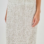Close-up view of white sequin fringe midi skirt highlighting the smooth satin waistband and upper tiered sequin detailing.