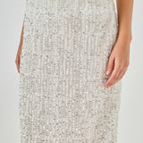 Close-up view of white sequin fringe midi skirt highlighting the smooth satin waistband and upper tiered sequin detailing.