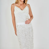 Face-forward posed view of white high-waisted sequin fringe midi skirt, showcasing the fit and textured movement.