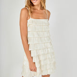 Face-forward posed view of cream tiered bubble mini dress featuring a model smiling in a front-facing pose.