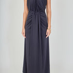 Close-up view of navy draped halter maxi dress featuring a high gathered halter neckline and draped front bodice.