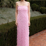 Lady wearing pink strapless ruffled maxi dress