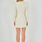 Straight-on back view of an ivory long-sleeve tweed mini dress showing the structured rear shoulders, fitted waist seams, and straight mini hem.