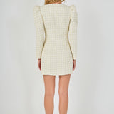 Straight-on back view of an ivory long-sleeve tweed mini dress showing the structured rear shoulders, fitted waist seams, and straight mini hem.