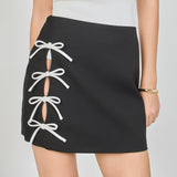 Renee Bow Cut Out Mini Skirt