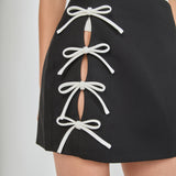 Renee Bow Cut Out Mini Skirt