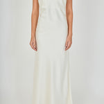 Close-up view of an ivory strapless satin maxi dress highlighting the fitted strapless bodice and smooth satin fabric.