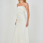 Side profile view of an ivory strapless satin maxi dress showing the sleek body-skimming fit and clean lateral seam.