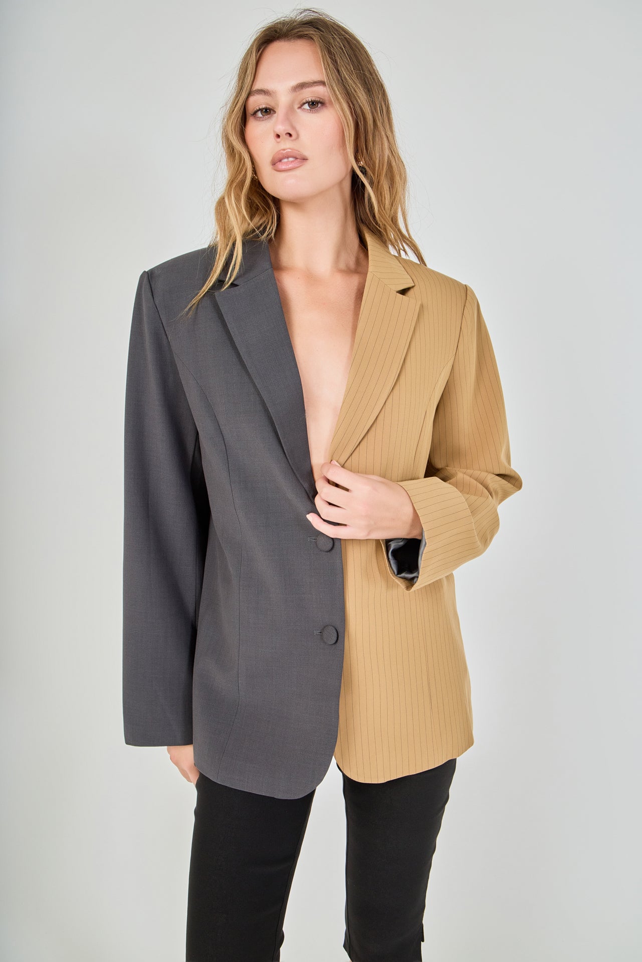 Tan and charcoal grey woven polyester blend straight-fit blazer featuring a half-pinstripe two-tone design, notch lapels, long sleeves, and center front button closures.