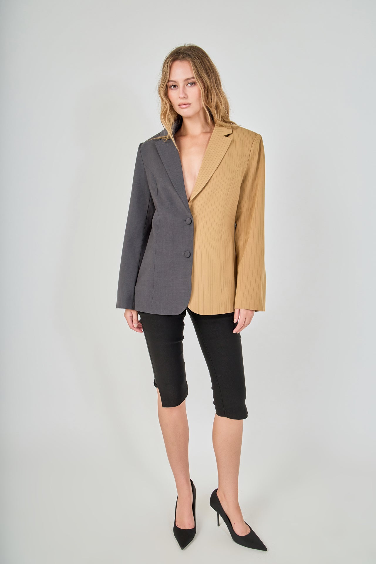 Tan and charcoal grey woven polyester blend straight-fit blazer featuring a half-pinstripe two-tone design, notch lapels, long sleeves, and center front button closures.