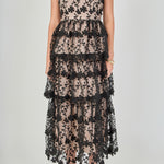 Close-up view of the dress bodice highlighting the sweetheart neckline, bustier seams, fitted waist, and intricate black floral embroidery over contrast beige lining.