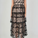 Close-up view of the dress bodice highlighting the sweetheart neckline, bustier seams, fitted waist, and intricate black floral embroidery over contrast beige lining.