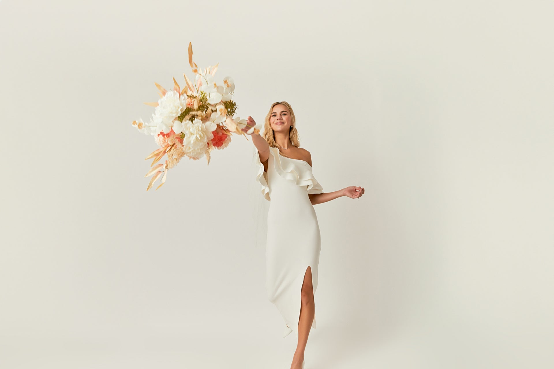 Throwing a bouquet in the Off The Shoulder Ruffle Maxi Dress featured in "The Wedding Edit" by Endless Rose