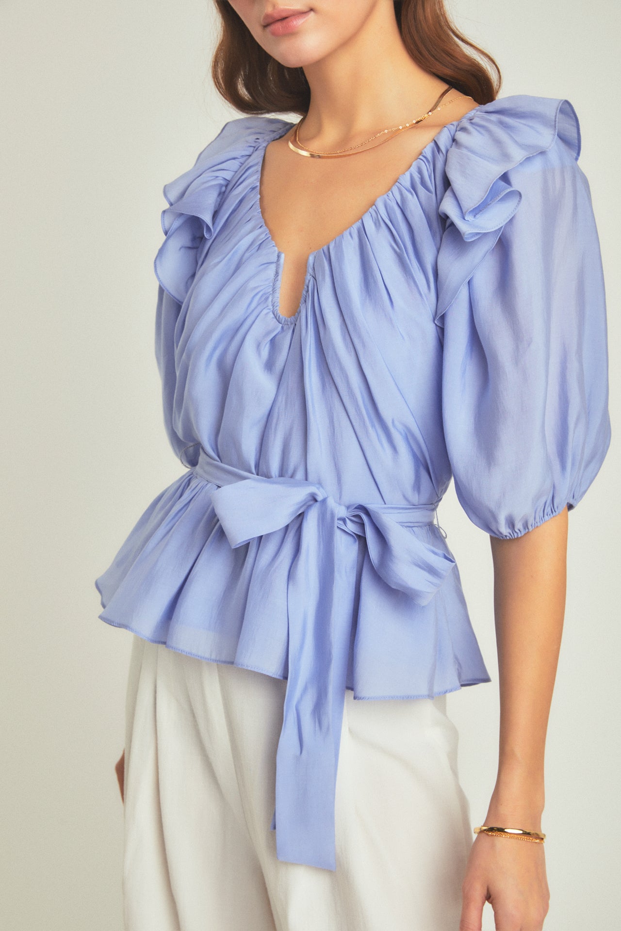 Discover our Puff Sleeve Peplum Blouse from our Spring Capsule: SS Wardrobe '24 Editorial