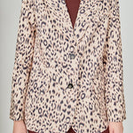 Beige multi leopard print woven oversized blazer featuring notched lapels, long sleeves with shoulder pads, front flap pockets, and a single-breasted button closure.