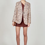 Beige multi leopard print woven oversized blazer featuring notched lapels, long sleeves with shoulder pads, front flap pockets, and a single-breasted button closure.