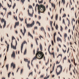 Beige multi leopard print woven oversized blazer featuring notched lapels, long sleeves with shoulder pads, front flap pockets, and a single-breasted button closure.