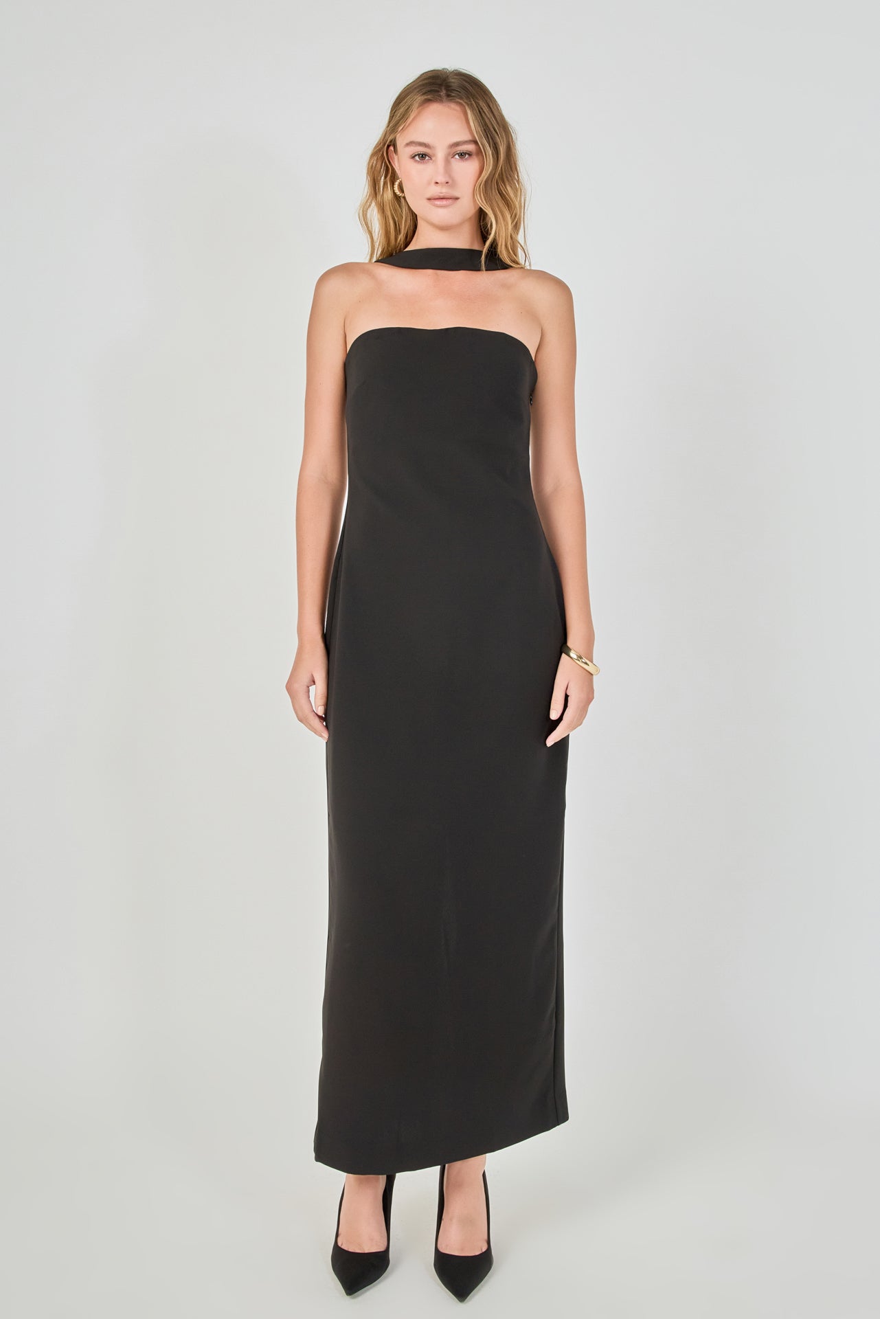 Full-length front view of a black strapless column maxi dress featuring a straight neckline, a matching fabric choker neckband, and a fitted column skirt.
