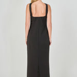 Back view of a black strapless column maxi dress showing the back choker neckband, low back cut, and long straight hemline.